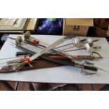 A mixed lot including two Leon Paul fencing foils, two machetes and seven other various swords,