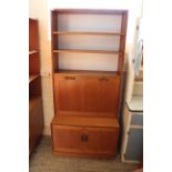 A G Plan cupboard bookcase comprising three shelves above a two door cupboard base