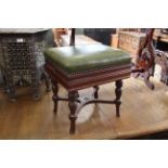 An Edwardian mahogany green leather topped stool