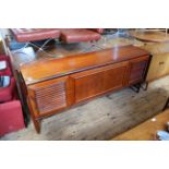 A long mid Century Danish style teak sideboard on with six drawers behind slatted sliding doors and