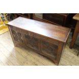 An early 19th Century carved oak coffer of small proportions