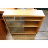 A mid Century design teak sloping glass fronted bookcase