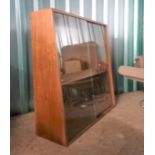 A mid Century floor standing graduated glazed bookcase