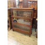 An oak three tier Globe Wernicke glazed sectional bookcase