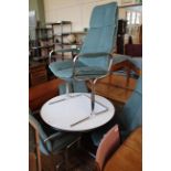 A vintage circular chrome and white melamine table with chrome and blue velour dining chairs