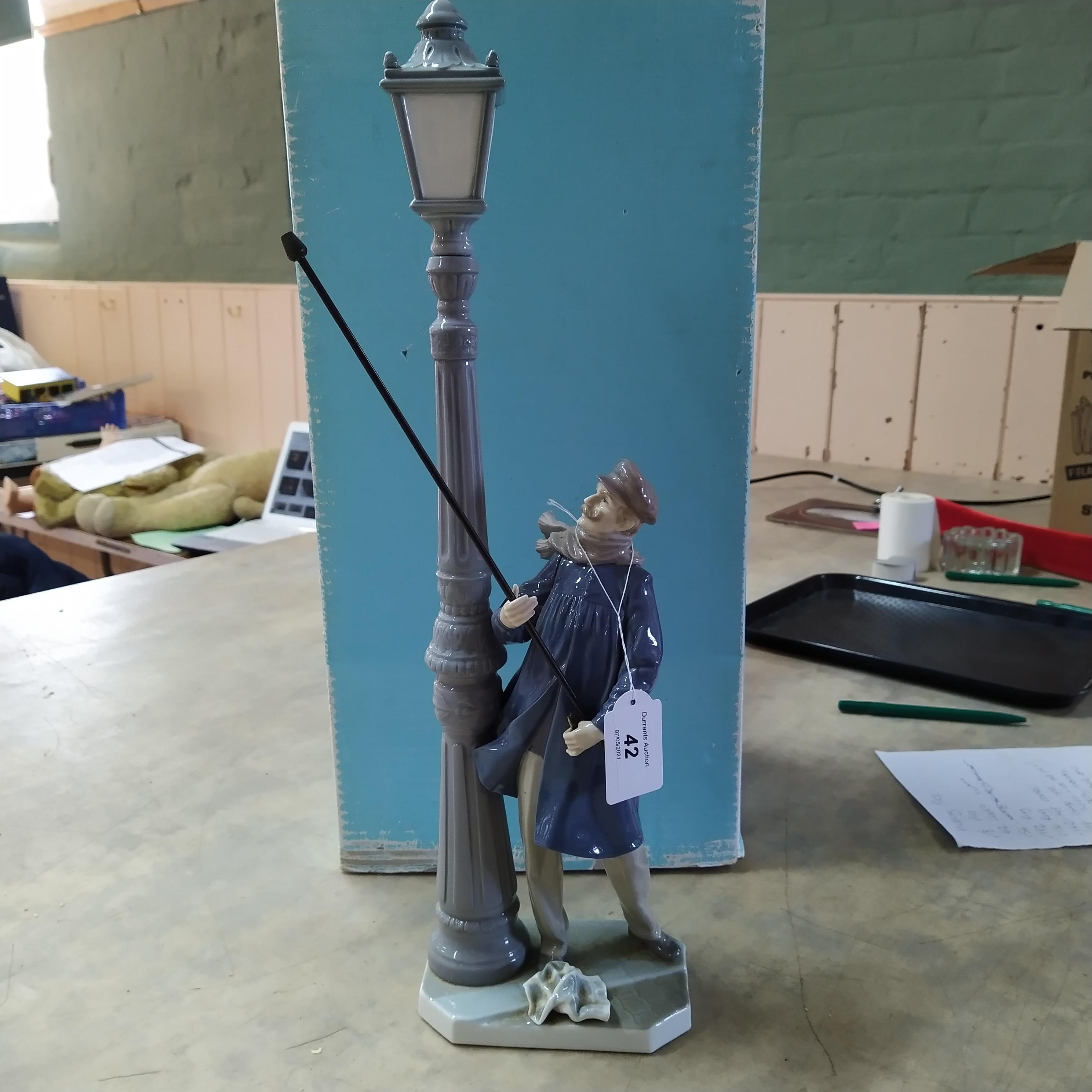 A boxed Lladro figurine The Lamp Lighter, signed to base by a member of the Lladro family,