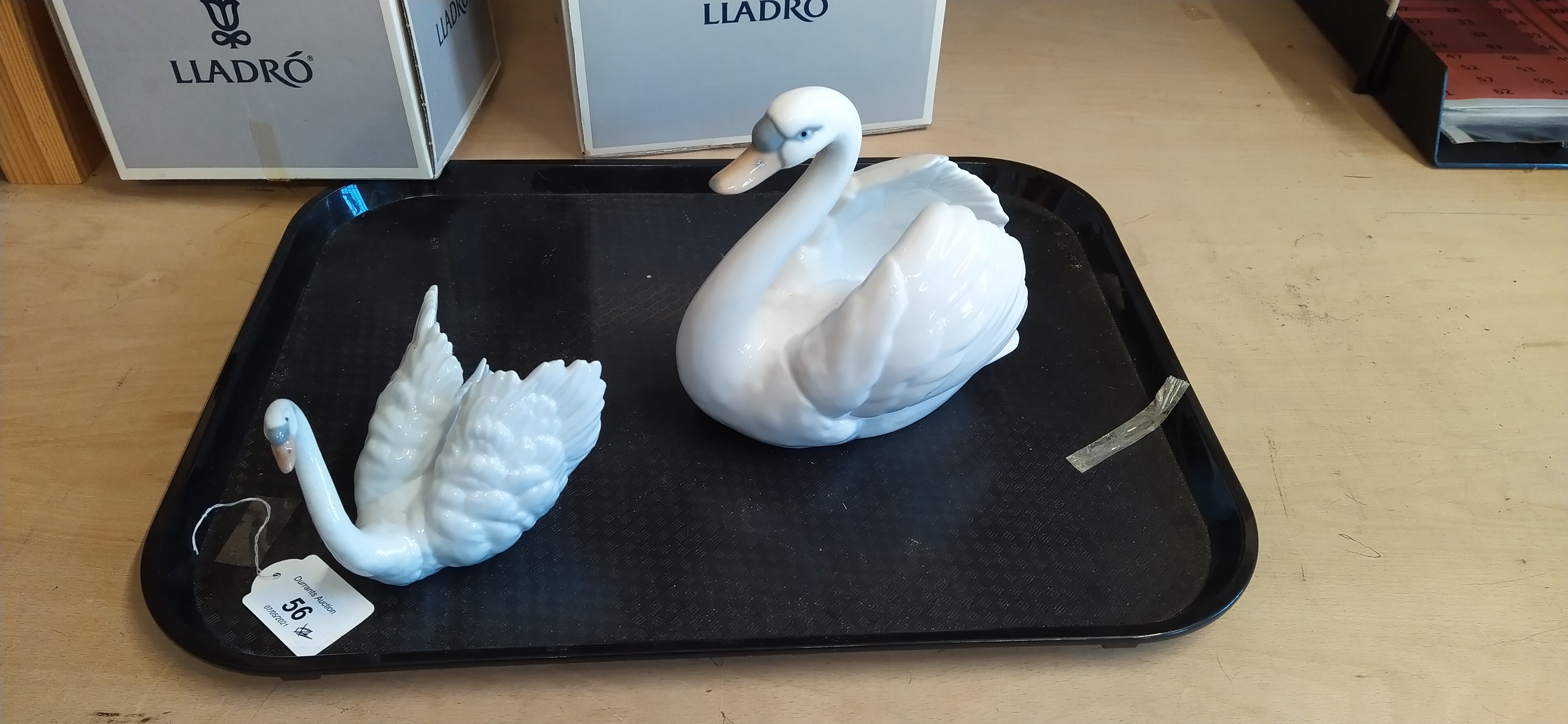 A boxed Lladro swan figurine plus a boxed Leonardo swan figurine,