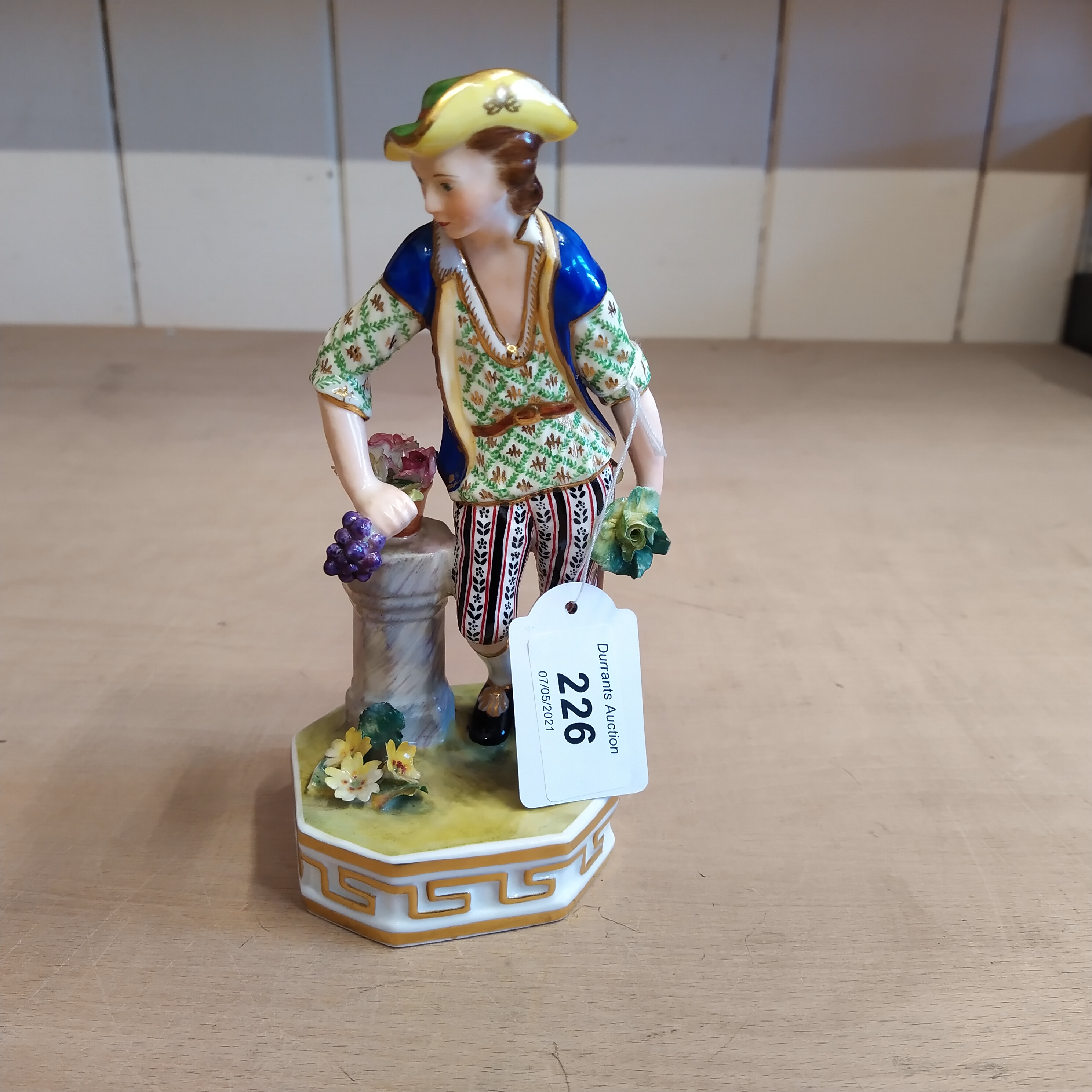 A Crown Derby figurine 'Earth', decorator B Hawson mark to base, circa 1820,