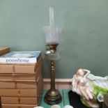 A Victorian brass oil lamp of tall proportions with moulded brass column,