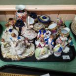 A tray of assorted porcelain figurines,