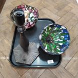 A bronze effect Tiffany style lamp base plus two stained glass shades