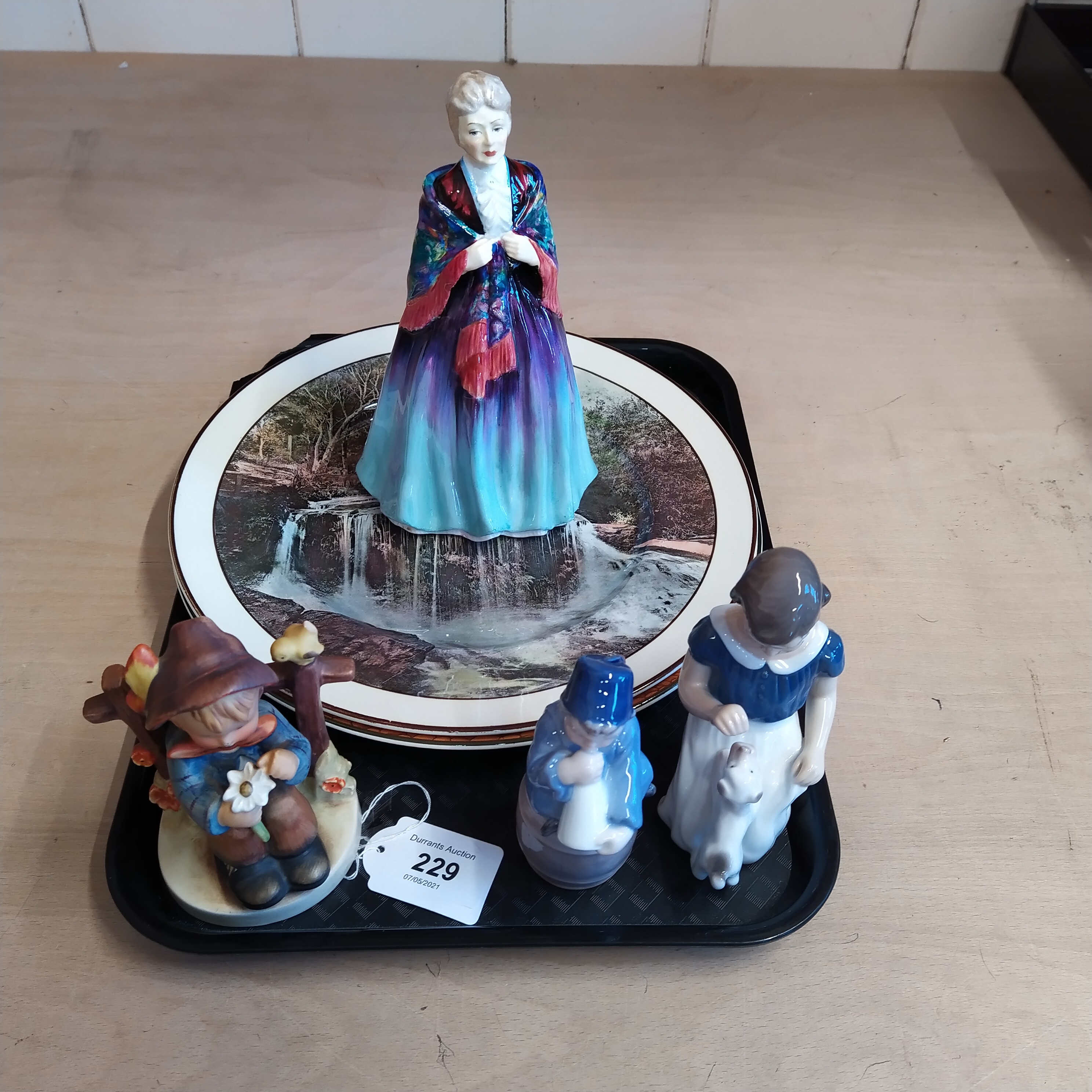 Two Doulton Series ware plates plus a Paragon Grand Ma Ma figurine,