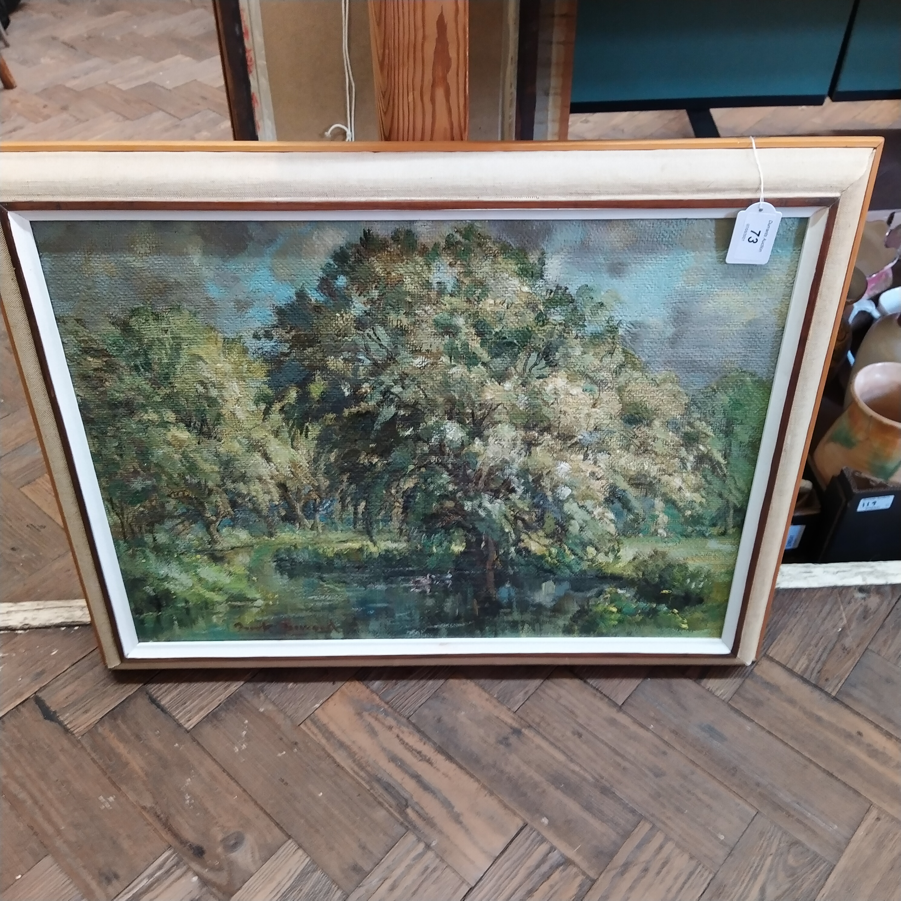 A framed oil on board of ducks on a lake with trees, signed bottom left, possibly Frank Dinwart,