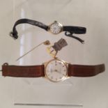 A lady's 9ct gold wristwatch on leather strap,