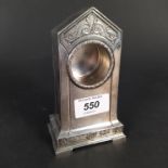 A WMF pocket watch stand of long case clock form with floral and swag decoration