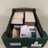 A large selection of postcard stamps plus a tub of loose UK and world stamps