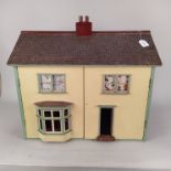 A vintage dolls house plus a tub of dolls house furniture,