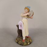 A Royal Worcester tambourine player marked 1032 to base,