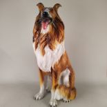 A large Italian porcelain figure of a seated collie dog, 33 1/2" high, length 19",