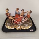 A large Capodimonte porcelain group of boys playing cards on a gilded Rococco base