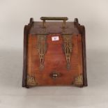 A late Victorian oak and brass bound coal box