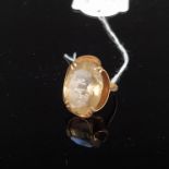 A 9ct gold ring set with a large quartz stone, size K, approx 6.
