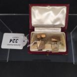 A pair of Art Deco 9ct gold rectangular cufflinks with engine turned decoration,