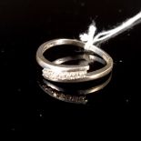 A 9ct white gold diamond set ring, size N 1/2, approx 1.