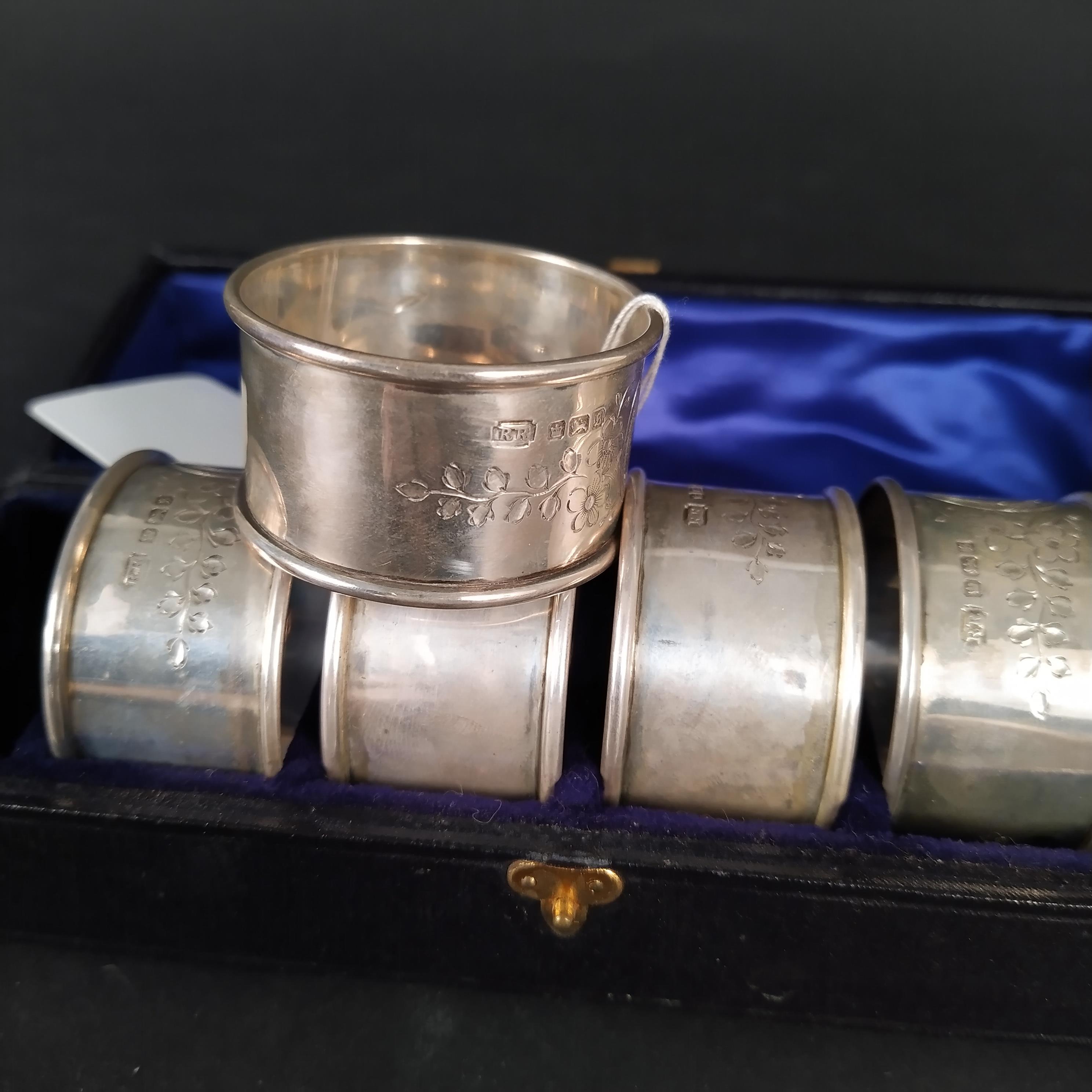 A cased set of six silver napkin rings with engraved foliate decoration, - Image 3 of 3