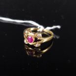 An 18ct gold red stone and diamond set ring, size K, approx 2.