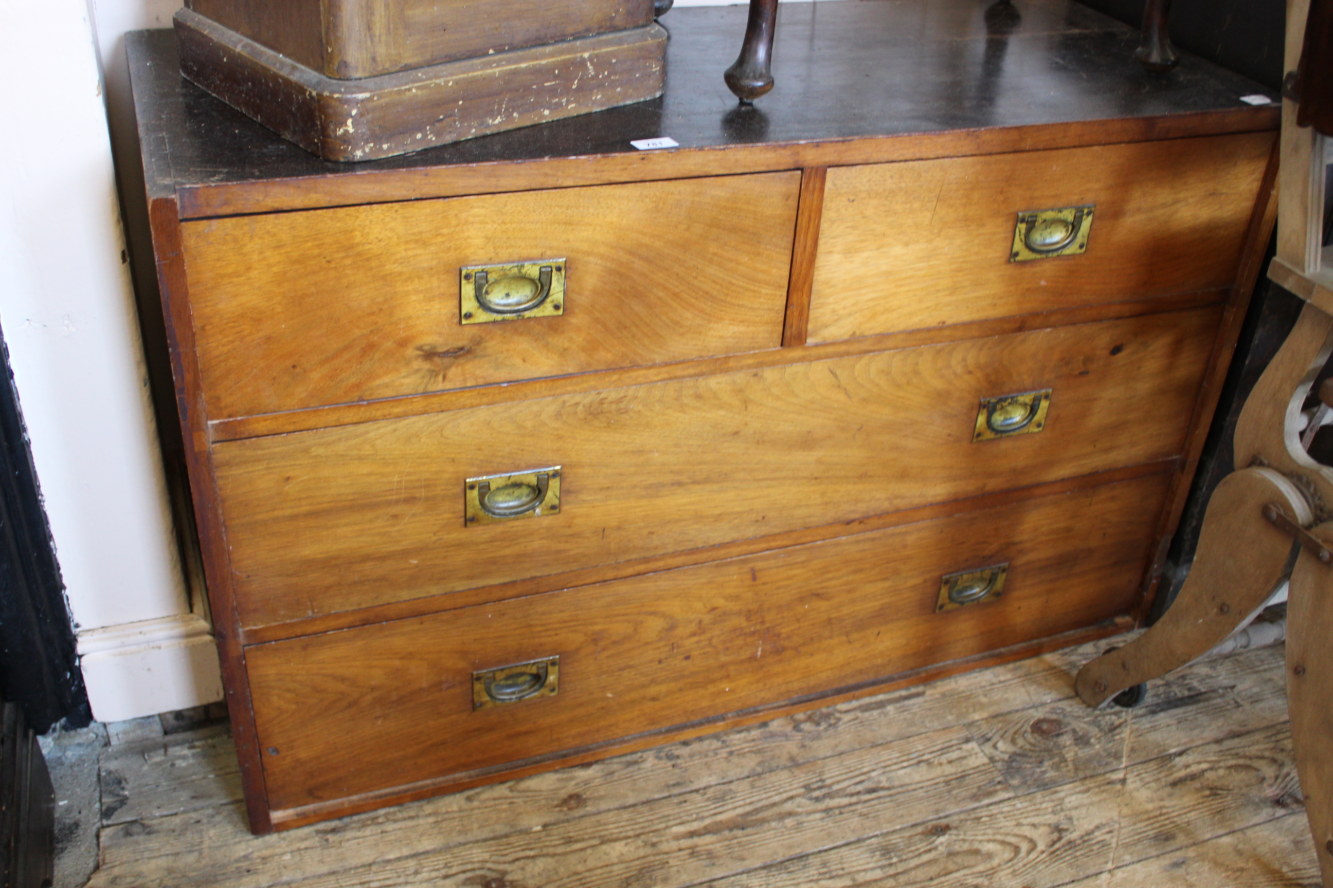 A late Victorian four drawer wardrobe section with military style handles