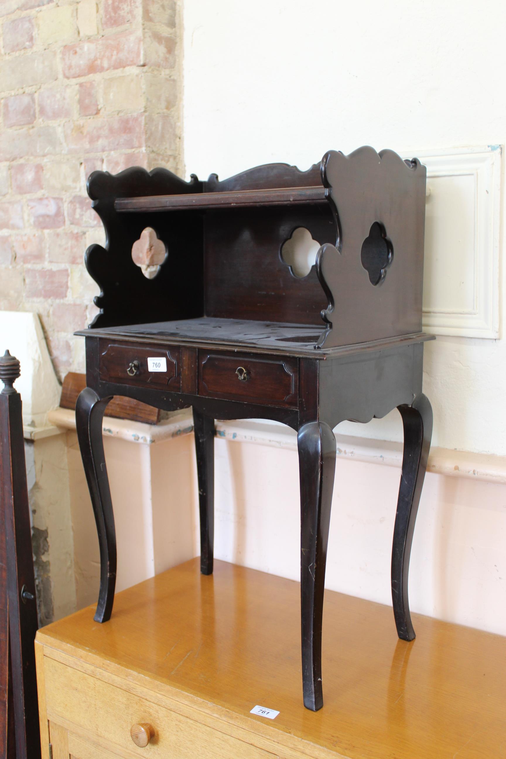 A 20th Century two drawer shelved side stand