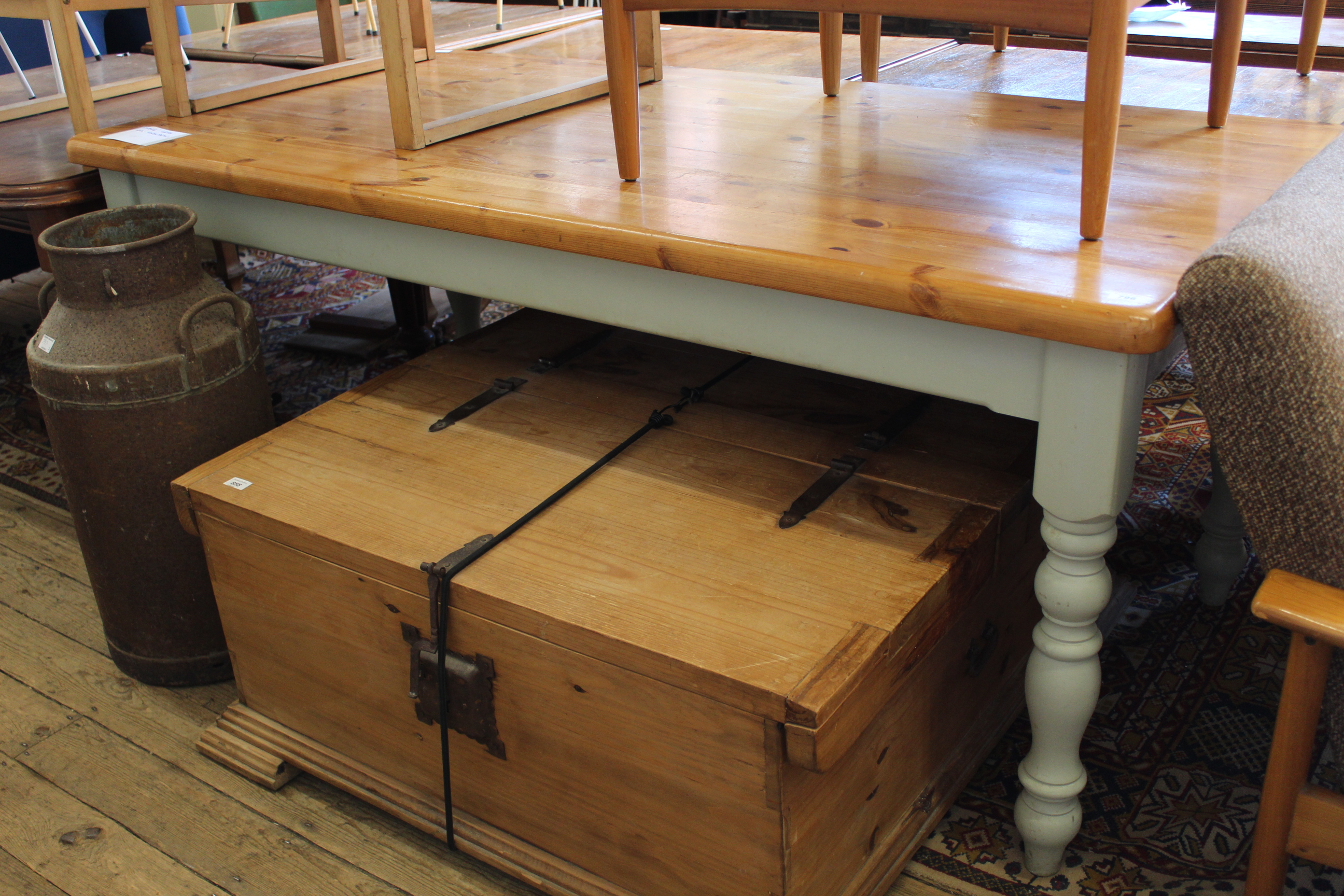 A Victorian style pine kitchen table on painted legs,