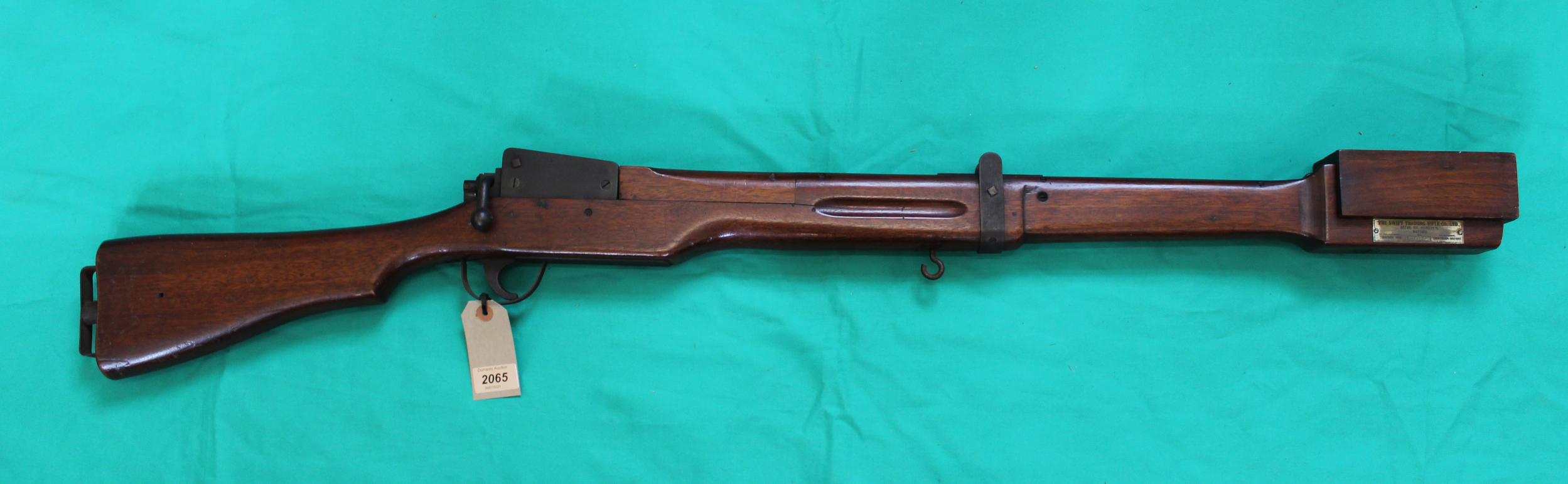 A Swift WWII era training rifle with muzzle cover, instruction booklet and three original targets,