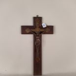 A large wooden cross with heavy brass Christ,