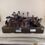A large quantity of assorted metal candlesticks