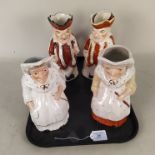 Two pairs of Victorian Punch and Judy Toby jugs, one Mr Punch with hat/lid,