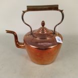 A large antique seamed copper kettle