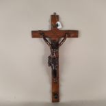 A large wooden cross with metal Christ,