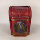 A vintage painted tin bird seed container with hand painted parakeets and gilded bands,