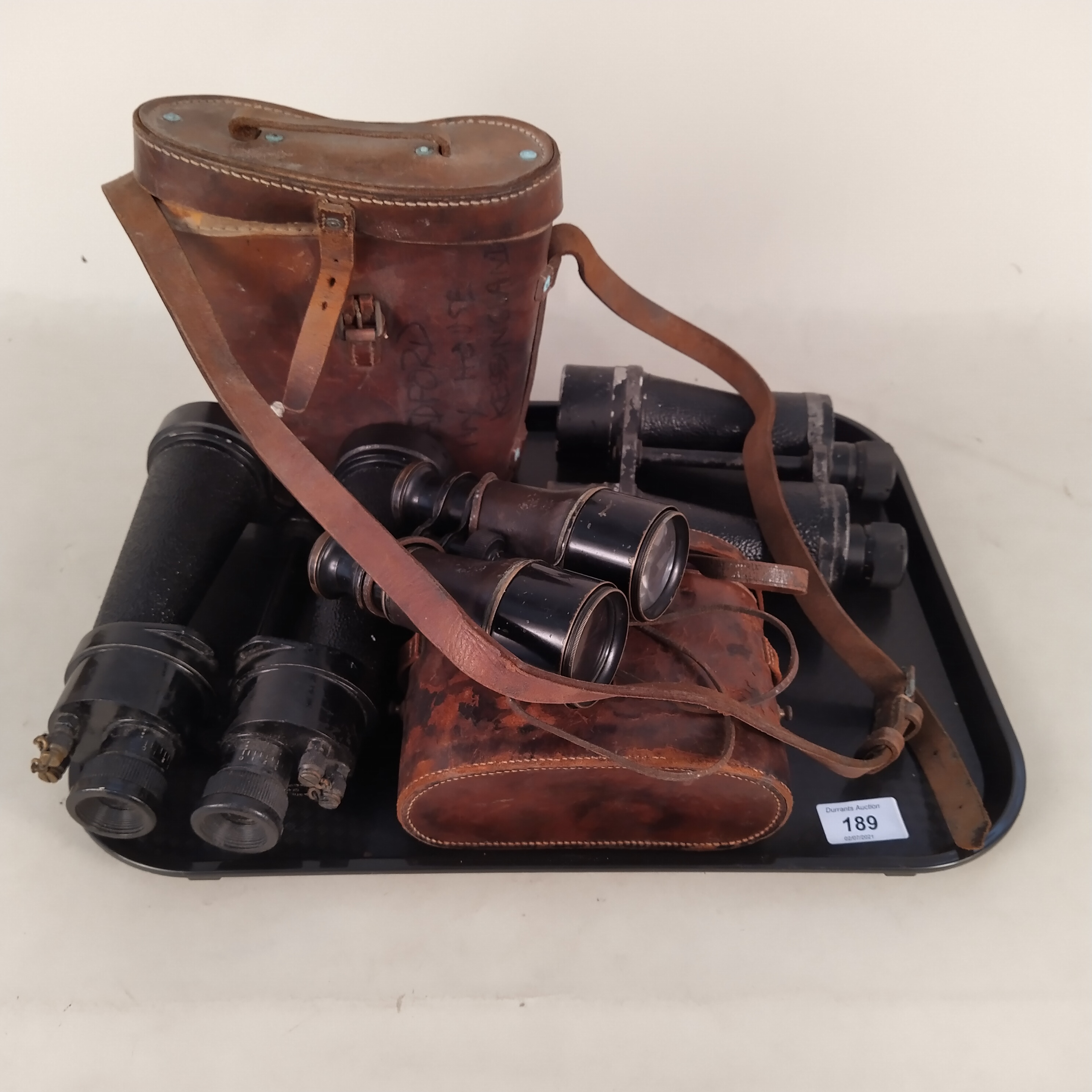 Four pairs of vintage binoculars by Barr & Stroud, Ross,