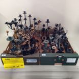 A large quantity of assorted metal candlesticks