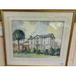 A framed watercolour of a country house signed J Goddard