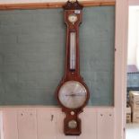 An early 19th Century banjo barometer, the rosewood case inlaid in tulip wood,