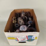 A box of silver plated teapots etc plus a pair of brass candlesticks and copper extendable