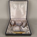 A 1930's cased white metal vanity set comprising a mirror,
