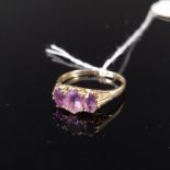 A 9ct gold three amethyst stone set ring, size S, weight approx 2.