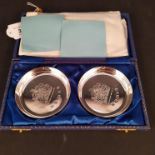 A boxed pair of silver pin dishes commemorating the Queen's Silver Jubilee,