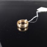 A 9ct gold band, size N,
