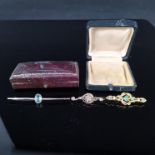 Three gold stone set bar brooches, two marked 9ct gold, one marked 18ct (two as found),